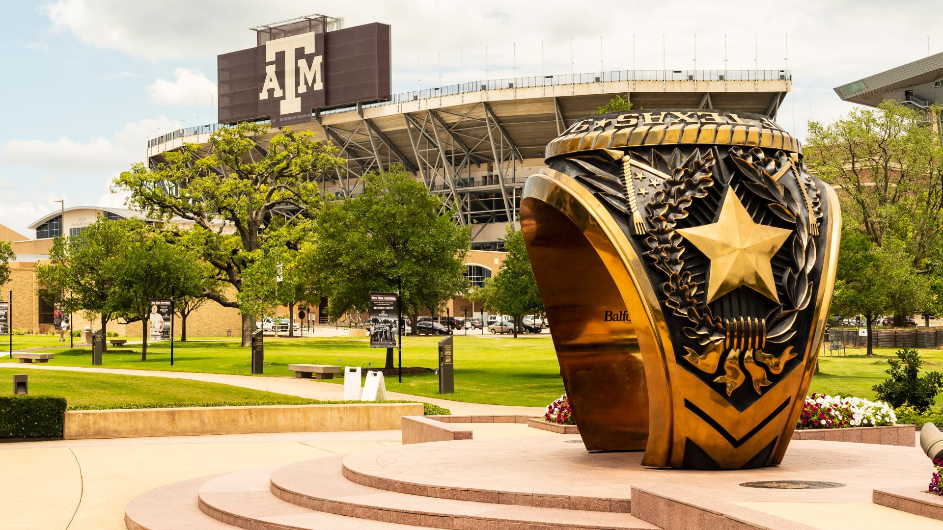 Texas A&M University football stadium with giant ring in foreground 