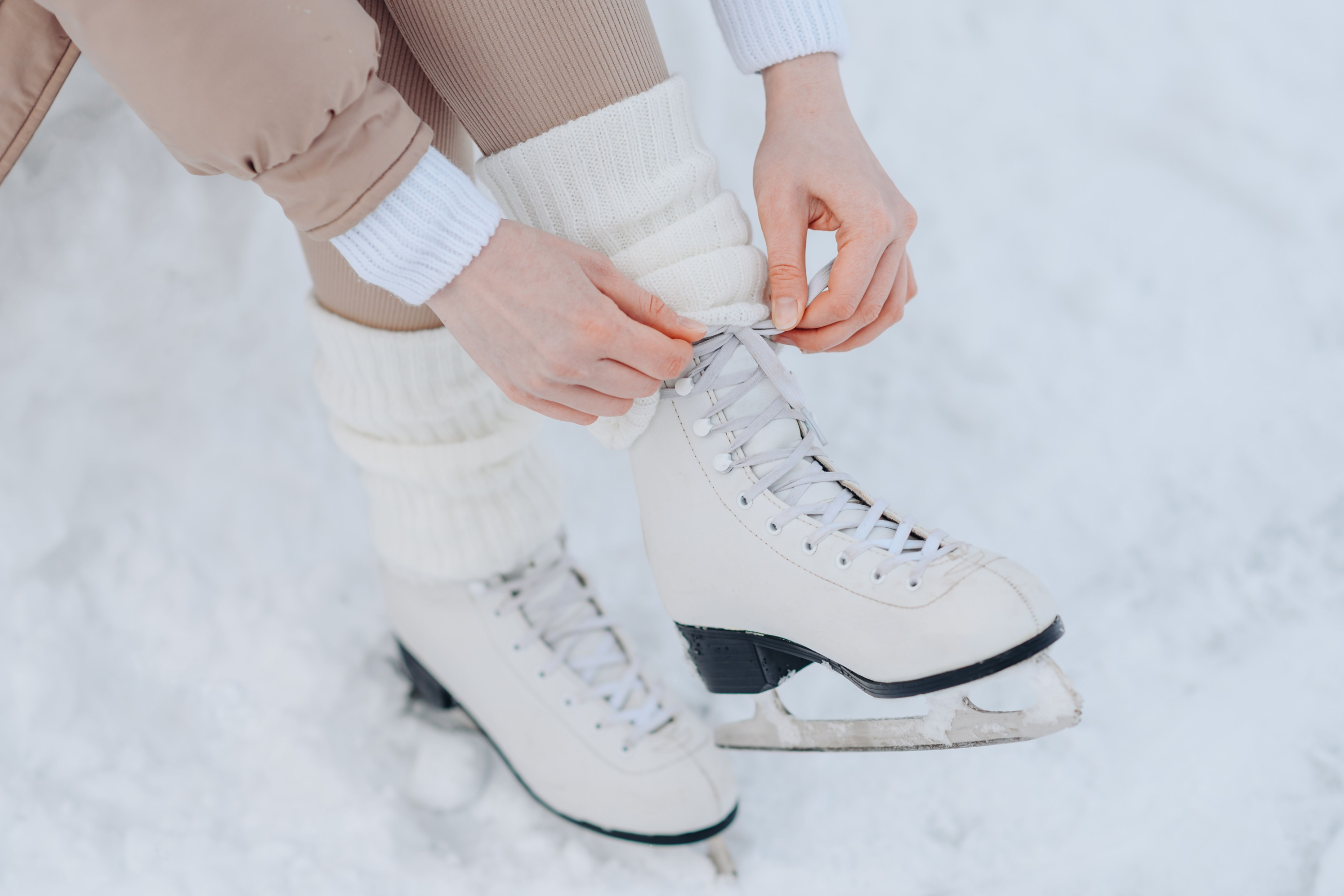 Girl lacing ice skates