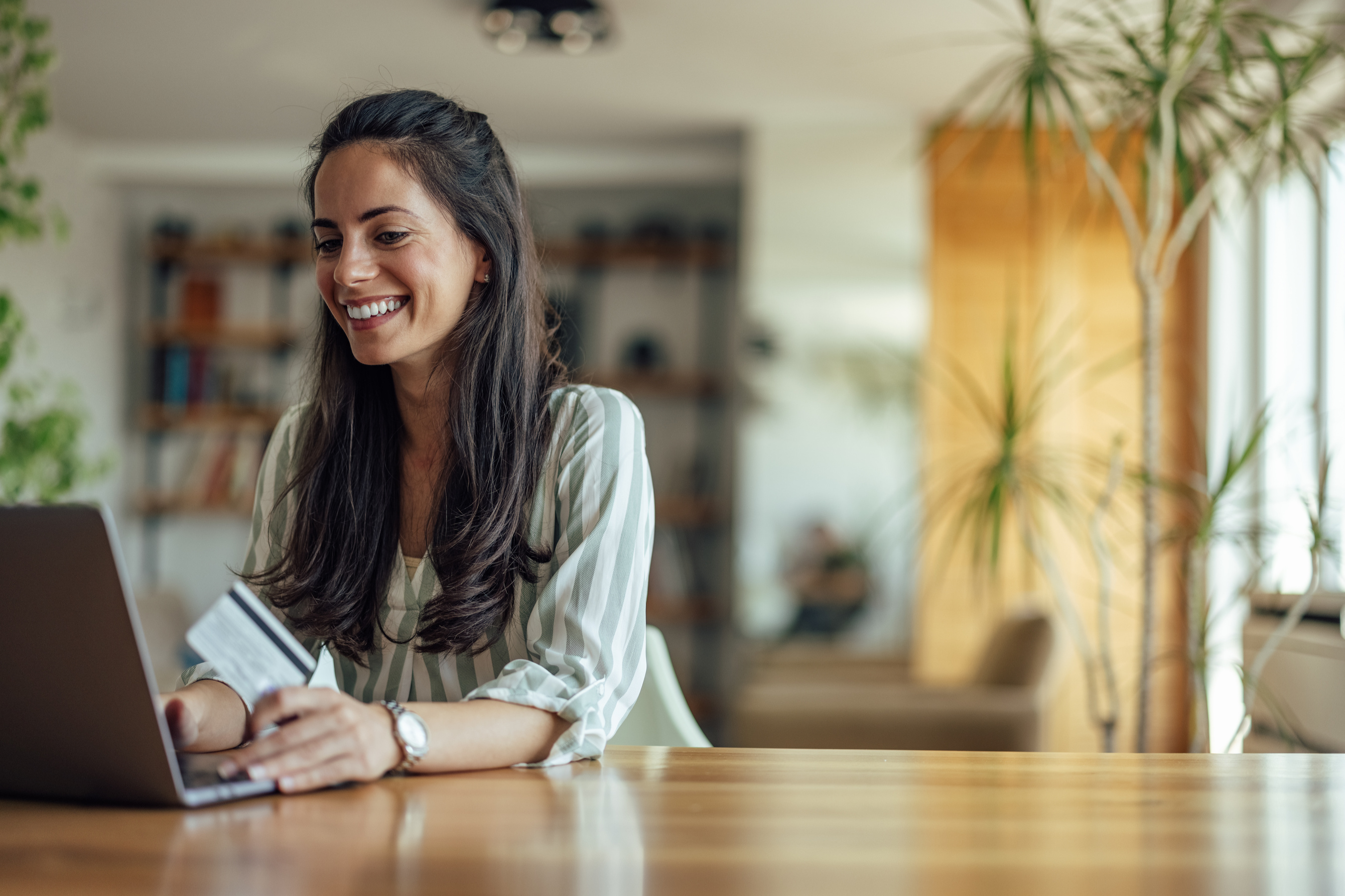 Smiling woman looking at computer